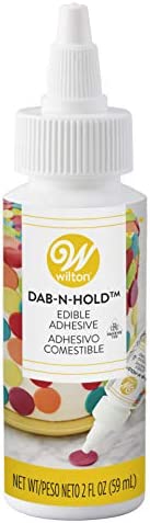 Wilton Dab-N-Hold Edible Adhesive, 2fl.oz (Packaging may vary)